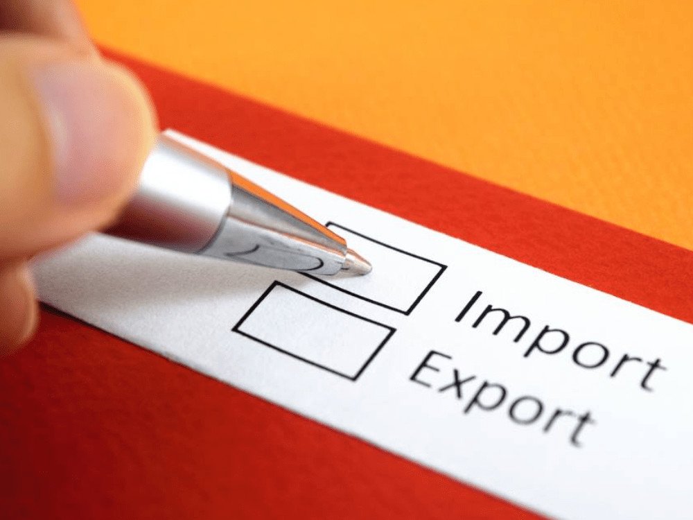 A pen ticks a box on a form with the options Import and Export.